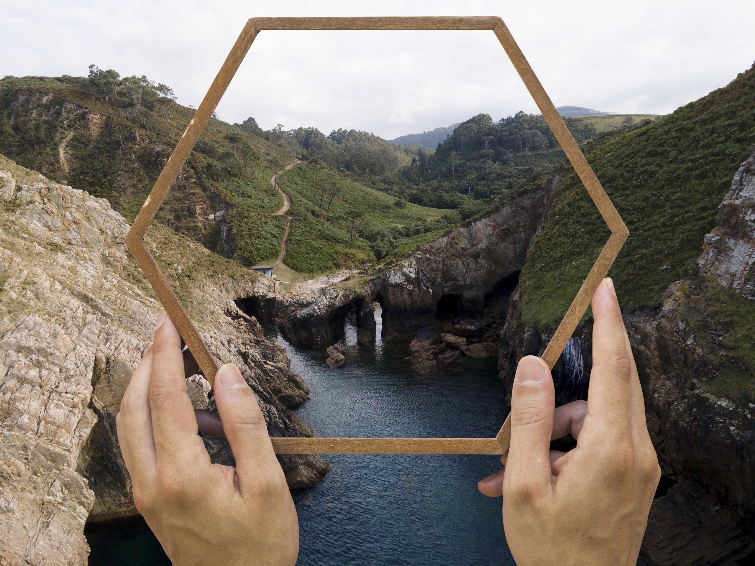 person holding frame with open nature landscape concept 1 scaled